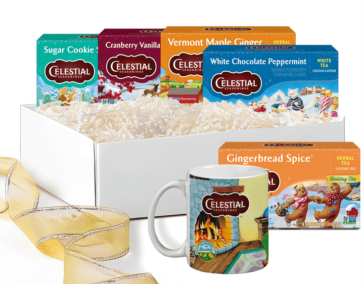 Celestial Seasonings tea packages and a mug called Festive Favorites Tea & Mug Gift Set  with a decorative ribbon on a white background